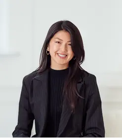 A person in a black suitAI-generated content may be incorrect.